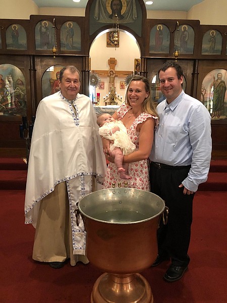 The proud parents with Maggie Juliet and Fr. Sergei