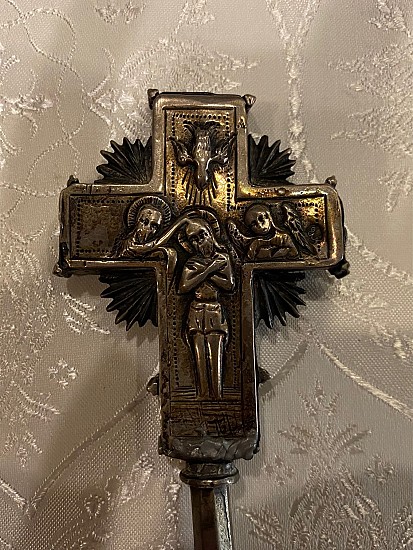 The silver cross used to bless the Holy Water.  This cross belonged to Archpriest Fr. Vasil Mandy, the first priest at St. George.  See below for some history on this cross.
