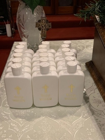 Due to COVID concerns, the newly blessed Holy Water was bottled and prepared for parishioners to take home.