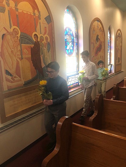 After Divine Liturgy, in procession with the Cross, followed by the parish children carrying flowers