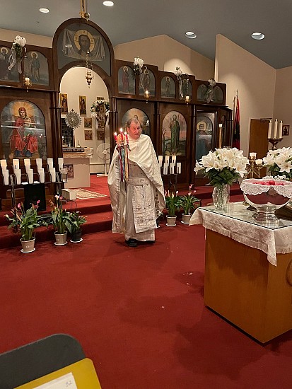 At the end of Divine Liturgy, Fr. Sergei coming out of the Altar to bless the Paschal eggs and foods