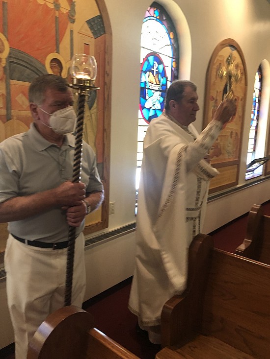 Blessing the congregation with the Cross at the south side of the church