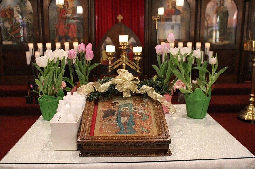 The Icon of the Feast of Theophany on the Center table on the Leavetaking of Theophany, with bottles of Holy Water that were blessed on Theophany.